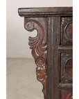Close-up of carved cabinet side bracket