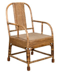 Natural rattan hand-woven armchair with rounded back and wooden legs, vintage Burmese country style, front view.