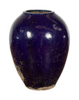 Cobalt blue glazed ceramic water vessel, antique Thai, oversized with tapering lines, scuffed base, on white background.