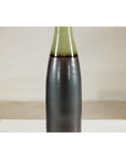Charcoal ceramic vase with moss green glazed neck, bottle silhouette, close-up.