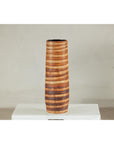Orange-brown ceramic vase with swirl design, artisan style, on display against a neutral background.