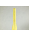 Close-up of tall skinny yellow ceramic vase with hand-painted flowers, narrow neck, on a light gray background.