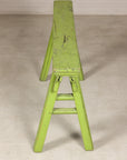 Opposite end view of green bench and A-frame support
