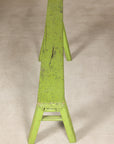 Narrow end view of green bench and seat top