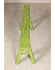 Narrow end view of green bench and seat top