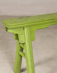 Green painted Chinese bench, close-up of left end and seat