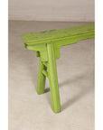 Close-up of green bench end and curved seat