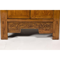 Large Elmwood 19th Cabinet with Carved Apron and Round Brass Medallion