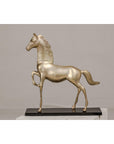 Silver over brass walking horse statuette on an ebonized oak base, neutral background, close-up view.