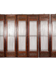Black lacquered wood six-panel screen with carved meander motifs, Qing Dynasty, ornate craftsmanship, full front view.