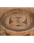 Brown wood 1920s Indian antique Chakki grinding table with hand-carved geometric patterns on a wooden floor.