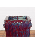Close-up of square red and blue ceramic Chinese vintage planter with knobs, mid-20th-century style.