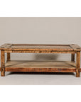 Distressed wood two-tier country style coffee table with inset top and straight legs, plain background.