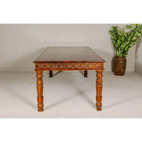 Large Dining Room Table with Carved Apron, Floral Motifs and Turned Legs