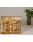 Brown mango wood and bone inlay buffet with two drawers, two doors; potted plant beside in corner.