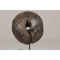 Ancient Rustic Cart Wheel Mounted on Black Lacquer Base