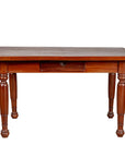 Brown teak antique Dutch Colonial Javanese desk with single drawer and turned legs, front view on white background.