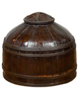 Dark wood antique decorative cover with rounded lid, polished finish, and unusual shape, close-up.