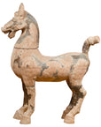 Brown terracotta horse sculpture, Han Dynasty era, with raised head and upright ears, mottled surface, close-up view.