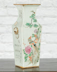 Blue and white porcelain altar vase with hand-painted flowers, birds, calligraphy, and lion head ornament.
