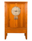 Brown elmwood Chinese armoire with two doors and central medallion hardware, Qing Dynasty, 19th century.