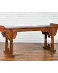 Dark wood Chinese altar console table with carved cloudy motifs and flanged top edges, Qing Dynasty 19th century.