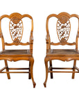 Brown wooden Chinese Qing Dynasty 19th-century armchair with carved medallion and cane seat on white background.