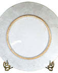 White porcelain Igezara transferware plate with thin gold rim on a metal stand.