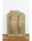 Green stone Thai wall plaque with ceremonial dancer carvings, temple-inspired design, close-up view.