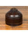 Dark wood Chinese antique decorative cover with unusual shape on wooden floor.