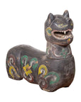 Close-up of carved and polychrome mythical guardian animal sculpture, antique wood, Northern Thai Chiang Mai style.