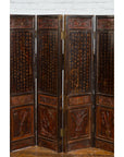 Brown and red wooden eight-panel Chinese screen with intricate carvings, gilt motifs, and decorative calligraphy.