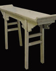 Distressed light wood altar table with curved ends and carved supports, antique finish, front view.