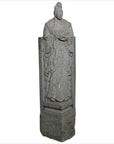 Gray stone hand-carved Chinese guardian sculpture of robed figure with ornate headdress on pedestal.