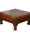 Brown wooden square coffee table with short round legs and weathered finish, antique Asian style.