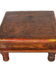 Brown wooden antique Asian prayer or coffee table, small and square with short legs and rustic, worn finish.