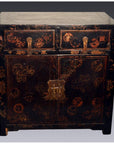 Black lacquered wood Chinese Chinoiserie cabinet with gold accents, red floral patterns, two drawers, scalloped hardware.