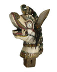 Close-up of a painted antique Burmese wood horse carving with carved details and open mouth showing teeth.