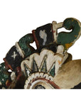 Close-up of green, white, and black painted wood Burmese ceremonial horse carving.
