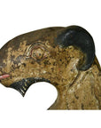 Brown hand-carved wood seated goat sculpture with black horn and paint wear on white background, 19th c. Burmese.