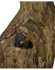 Faded painted wood seated goat sculpture with cracks, hand-carved, antique Burmese 19th c., side view on white background.