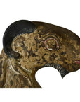 Brown hand-carved wood goat sculpture with black horn, painted and weathered details, seated position.