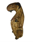 Brown hand-carved wood seated goat sculpture with rounded features and worn paint, antique Burmese, side view.