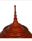 Close-up of a red carved wood Burmese offering basket, antique 19th century, on a white background.