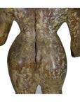 Brown weathered and cracked wooden sculpture of a human back and hips on a plain white background.