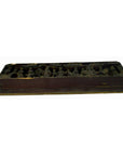 Brown wood temple plaque with raised shapes, antique Chinese style, seen from low angle.