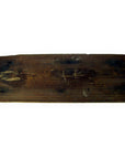 Close-up of weathered dark-stained wood Chinese temple plaque, antique architectural panel against plain background.
