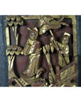 Red and gold wood Chinese wedding bed plaque with two robed figures, one standing, one kneeling among carved trees.