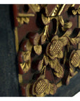 Close-up of red and gold ornate wood Chinese wedding bed plaque, 11.5 x 6 x 0.75 inches.