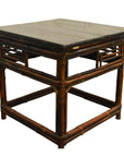Brown bamboo side table with flat wood top, decorative frame legs, and lacquered finish, antique style.